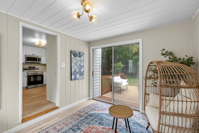 29 Bradford Dr, Windsor, CT 06095 - doorway featuring light wood-style flooring and baseboards