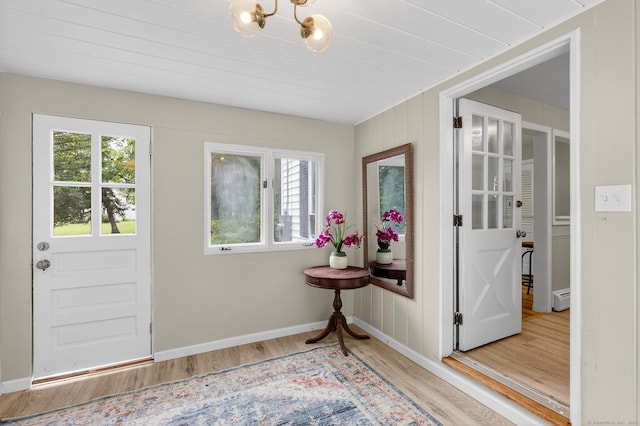 29 Bradford Dr, Windsor, CT 06095 - foyer entrance featuring wood finished floors, baseboard heating, and a chandelier