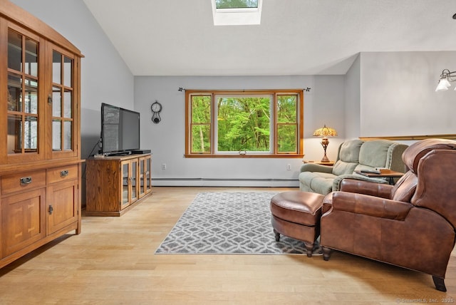 44 Brindlewood Path, Colchester, CT 06415 - living area with a baseboard radiator, light wood-type flooring, a skylight, and lofted ceiling