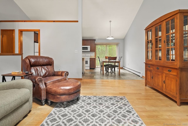 44 Brindlewood Path, Colchester, CT 06415 - living area with baseboard heating, lofted ceiling, and light wood-style flooring