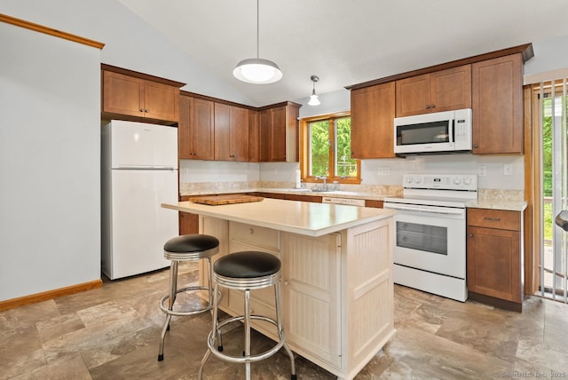 44 Brindlewood Path, Colchester, CT 06415 - kitchen with white appliances, vaulted ceiling, healthy amount of natural light, light countertops, and a kitchen island
