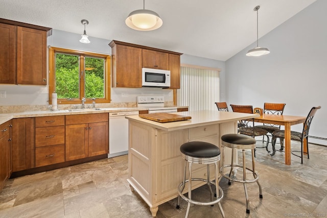 44 Brindlewood Path, Colchester, CT 06415 - kitchen with white appliances, light countertops, a center island, a breakfast bar, and vaulted ceiling
