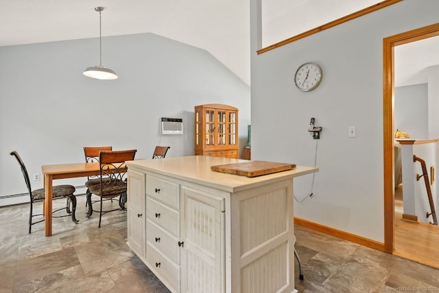 44 Brindlewood Path, Colchester, CT 06415 - kitchen with lofted ceiling, decorative light fixtures, a center island, white cabinetry, and light countertops