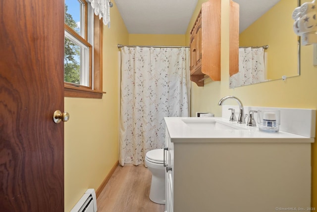 44 Brindlewood Path, Colchester, CT 06415 - full bath featuring a baseboard radiator, vanity, wood finished floors, and a shower with shower curtain