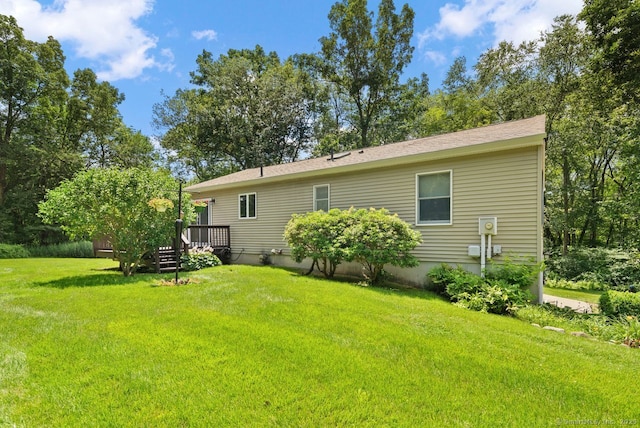 44 Brindlewood Path, Colchester, CT 06415 - rear view of house with a lawn and a deck