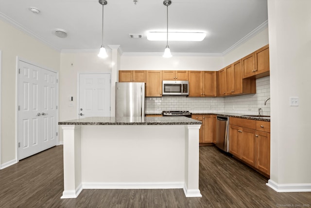 25 Adams Ave Unit 103, Stamford, CT 06902 - kitchen with stainless steel appliances, crown molding, dark wood finished floors, and backsplash