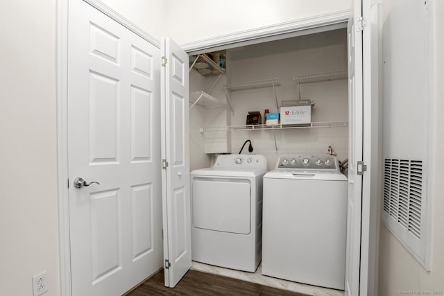 25 Adams Ave Unit 103, Stamford, CT 06902 - laundry room featuring washer and clothes dryer, a heating unit, and dark wood-type flooring