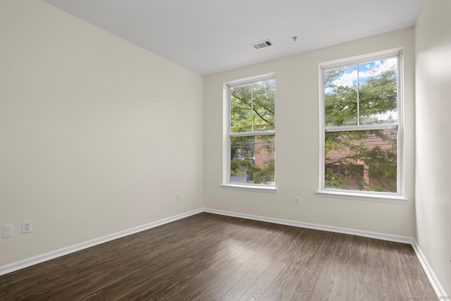25 Adams Ave Unit 103, Stamford, CT 06902 - unfurnished room featuring dark wood-style flooring and baseboards