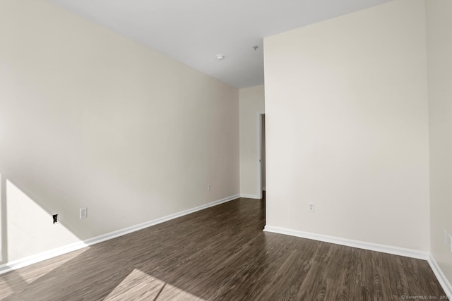 25 Adams Ave Unit 103, Stamford, CT 06902 - empty room with dark wood-style floors and baseboards