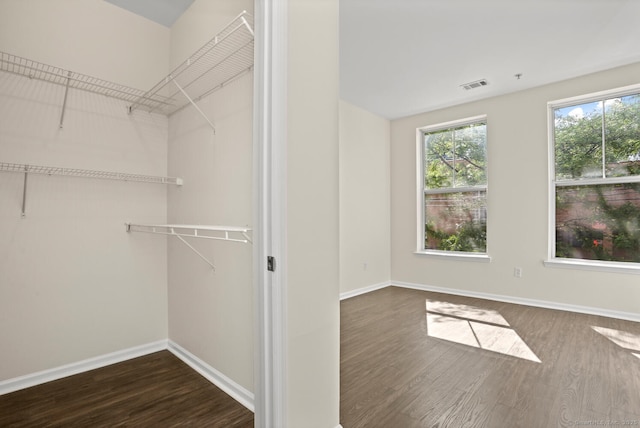 25 Adams Ave Unit 103, Stamford, CT 06902 - walk in closet featuring dark wood finished floors