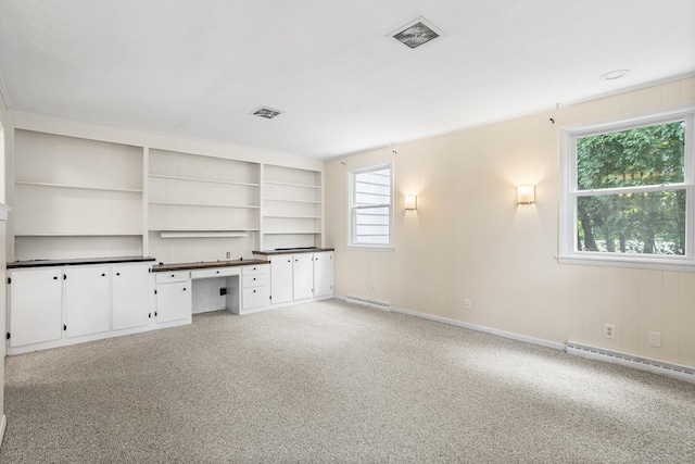 253 Simsbury Rd, West Hartford, CT 06117 - unfurnished office featuring a baseboard radiator, built in desk, and light carpet