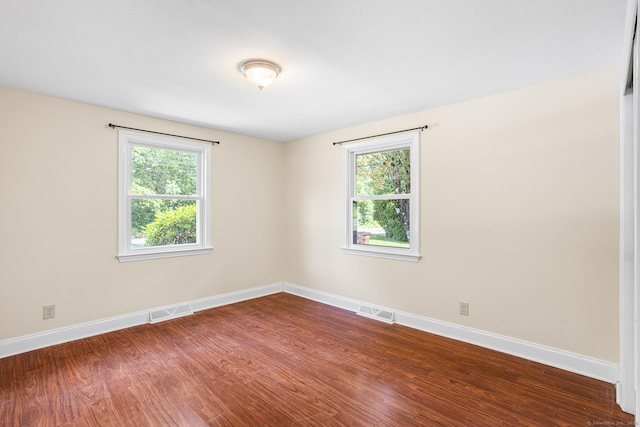 253 Simsbury Rd, West Hartford, CT 06117 - unfurnished room with dark wood finished floors and healthy amount of natural light
