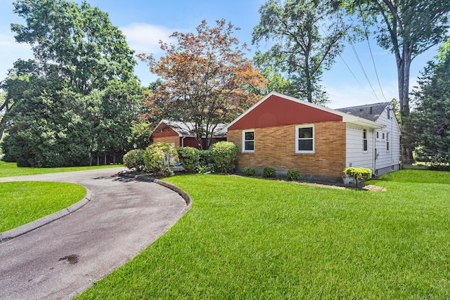 253 Simsbury Rd, West Hartford, CT 06117 - view of side of home featuring a lawn and curved driveway