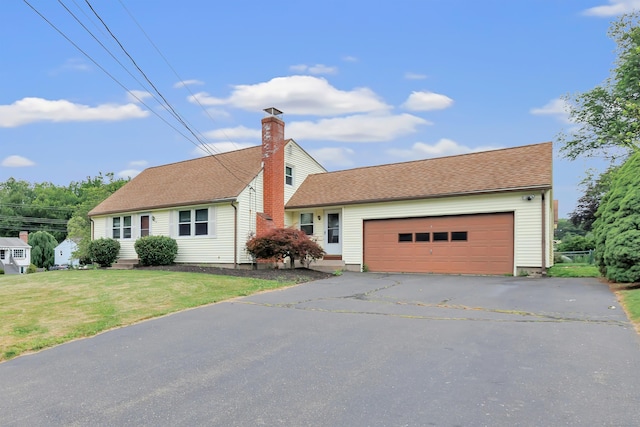 66 Bridgeport Ave, Bristol, CT 06010 - view of front facade with an attached garage, driveway, a front yard, and a chimney