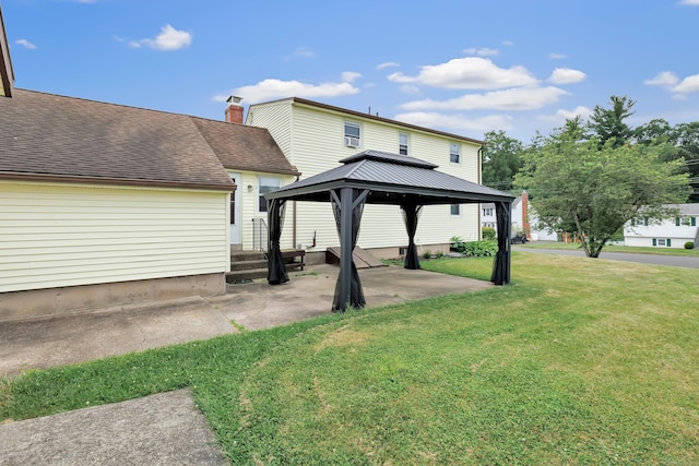 66 Bridgeport Ave, Bristol, CT 06010 - rear view of property featuring a gazebo, a patio area, a lawn, and roof with shingles