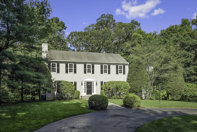 70 Fitch Ln, New Canaan, CT 06840 - colonial home with a chimney and a front yard