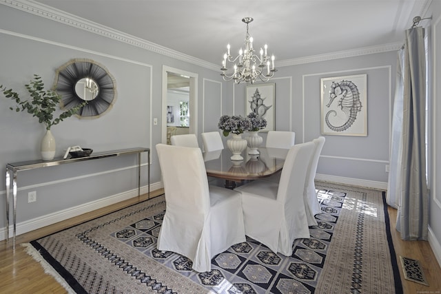 70 Fitch Ln, New Canaan, CT 06840 - dining room featuring a chandelier, wood finished floors, and crown molding