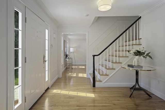 70 Fitch Ln, New Canaan, CT 06840 - foyer with stairs, wood finished floors, and ornamental molding