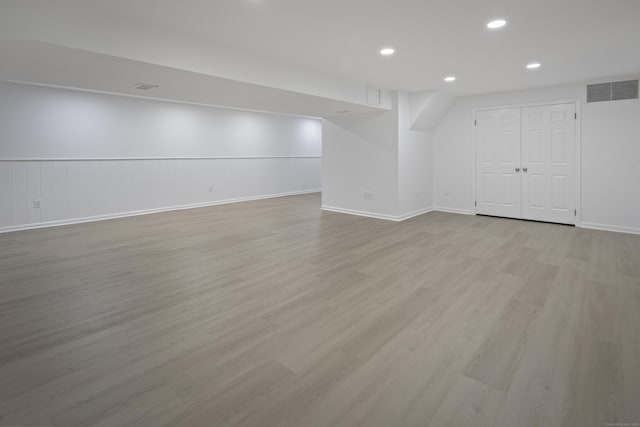 70 Fitch Ln, New Canaan, CT 06840 - finished below grade area with light wood-style flooring and recessed lighting