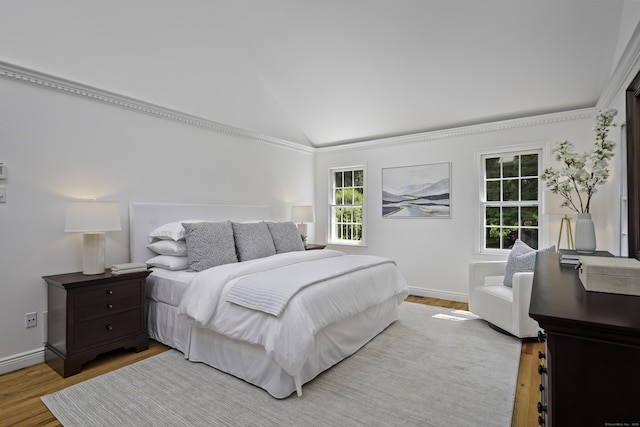 70 Fitch Ln, New Canaan, CT 06840 - bedroom with lofted ceiling and light wood-style floors