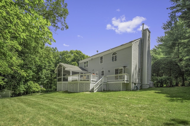 70 Fitch Ln, New Canaan, CT 06840 - back of house with a sunroom, a chimney, a deck, a lawn, and stairway
