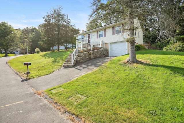 8 Rain Dance Cir, Naugatuck, CT 06770 - view of front of property featuring asphalt driveway, a garage, a front lawn, and stairway