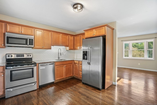 8 Rain Dance Cir, Naugatuck, CT 06770 - kitchen featuring stainless steel appliances, light stone countertops, decorative backsplash, and dark wood-type flooring