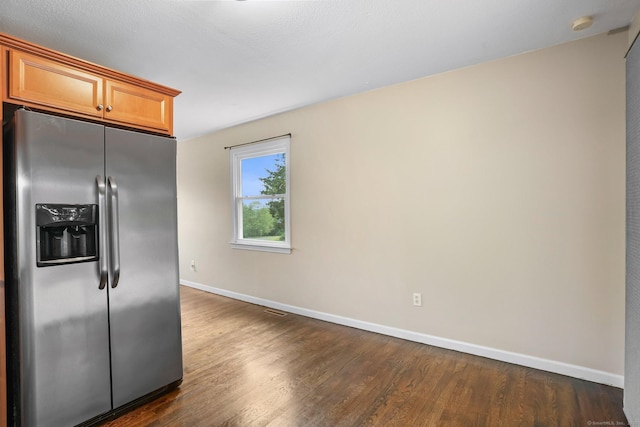 8 Rain Dance Cir, Naugatuck, CT 06770 - kitchen with stainless steel fridge, dark wood finished floors, and brown cabinets