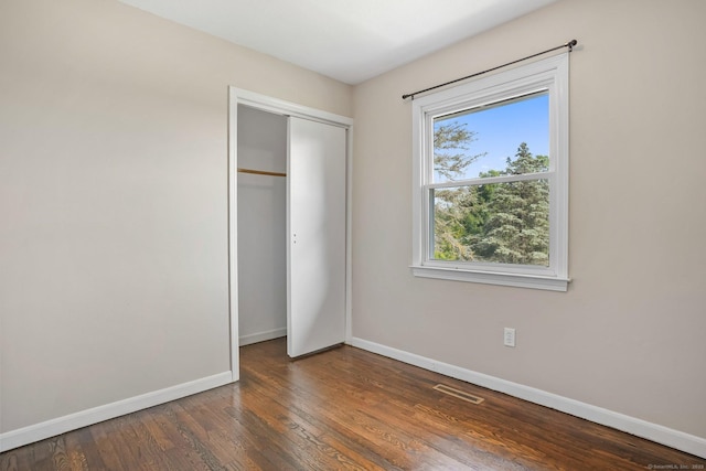 8 Rain Dance Cir, Naugatuck, CT 06770 - unfurnished bedroom featuring wood finished floors and a closet