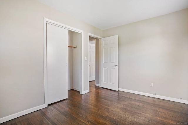8 Rain Dance Cir, Naugatuck, CT 06770 - unfurnished bedroom featuring dark wood-style floors and a closet