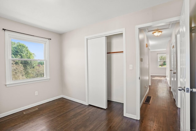 8 Rain Dance Cir, Naugatuck, CT 06770 - unfurnished bedroom with attic access, dark wood finished floors, and a closet