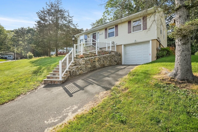 8 Rain Dance Cir, Naugatuck, CT 06770 - ranch-style house featuring an attached garage, driveway, a front yard, and stairs