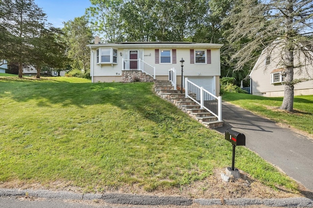 8 Rain Dance Cir, Naugatuck, CT 06770 - single story home with driveway, a garage, and a front yard