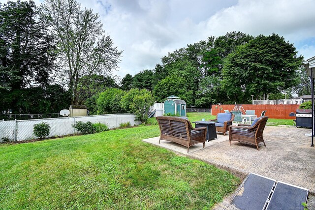 16 Kenwood Rd, Meriden, CT 06450 - fenced backyard featuring a storage shed, a patio area, and outdoor lounge area