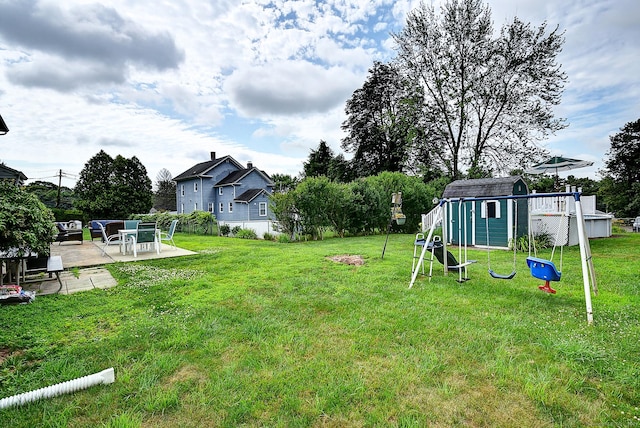 16 Kenwood Rd, Meriden, CT 06450 - view of green lawn featuring a patio area and a storage unit