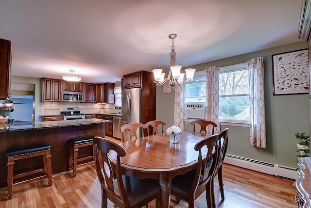 16 Kenwood Rd, Meriden, CT 06450 - dining space featuring a baseboard radiator, a chandelier, and light wood-style flooring