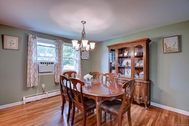 16 Kenwood Rd, Meriden, CT 06450 - dining area with a baseboard radiator, a chandelier, cooling unit, and light wood-style flooring