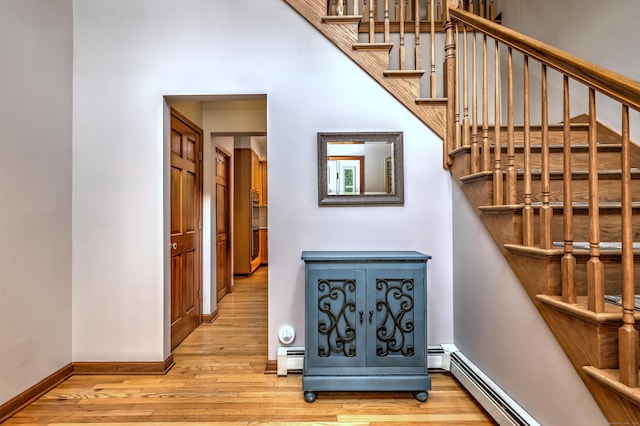330 Webb Cir, Monroe, CT 06468 - staircase featuring wood finished floors, baseboard heating, and a baseboard radiator