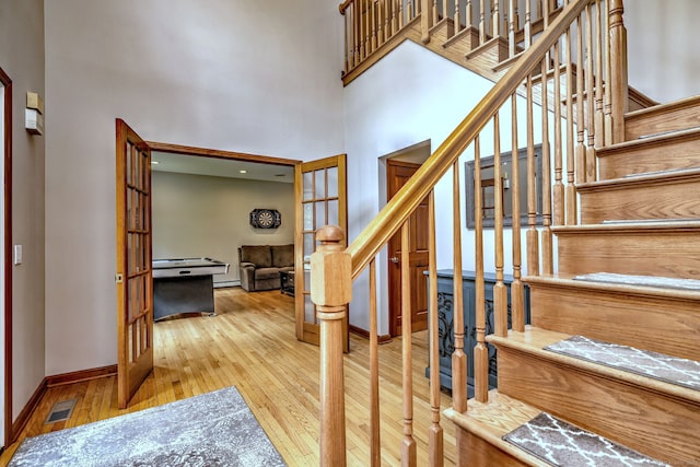 330 Webb Cir, Monroe, CT 06468 - staircase featuring hardwood / wood-style floors and a high ceiling