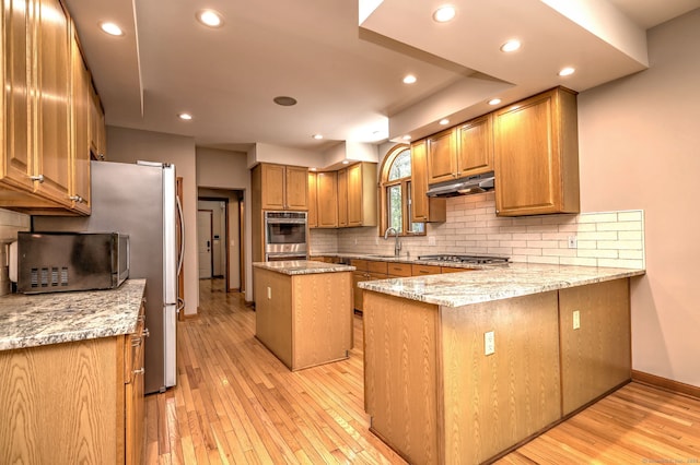 330 Webb Cir, Monroe, CT 06468 - kitchen featuring tasteful backsplash, light wood-type flooring, a peninsula, light stone counters, and recessed lighting