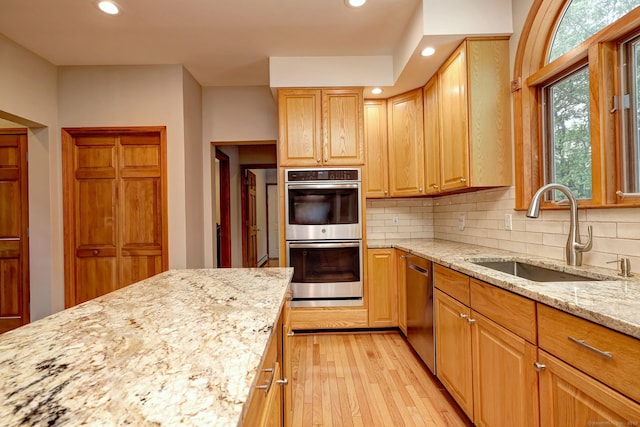 330 Webb Cir, Monroe, CT 06468 - kitchen with stainless steel appliances, light wood-type flooring, recessed lighting, light stone counters, and backsplash