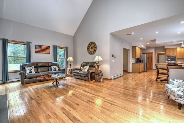 330 Webb Cir, Monroe, CT 06468 - living area with high vaulted ceiling, light wood-style floors, and baseboard heating