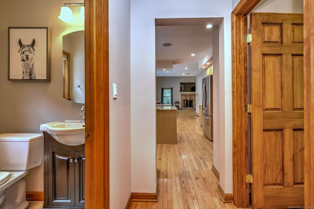 330 Webb Cir, Monroe, CT 06468 - hallway with light wood-style flooring, recessed lighting, and arched walkways