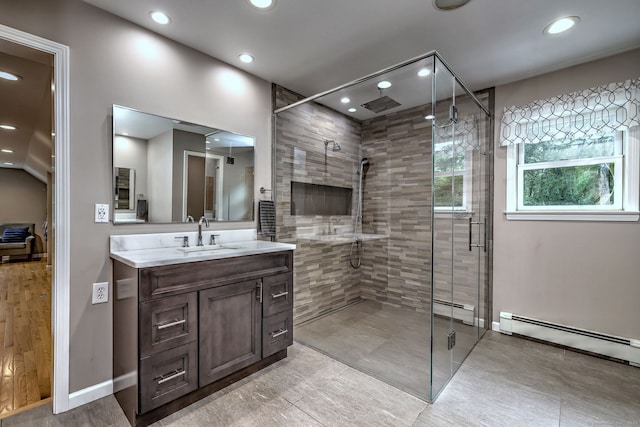 330 Webb Cir, Monroe, CT 06468 - bathroom featuring recessed lighting, a stall shower, vanity, and a baseboard heating unit