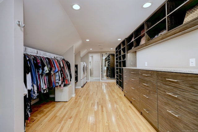 330 Webb Cir, Monroe, CT 06468 - spacious closet featuring light wood-style floors, lofted ceiling, and washer / dryer