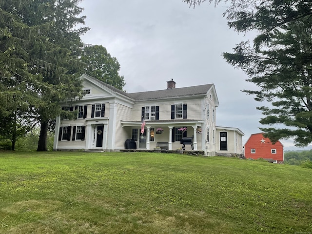 24 John Weik Rd, Morris, CT 06763 - view of front of house with a chimney, covered porch, and a front yard