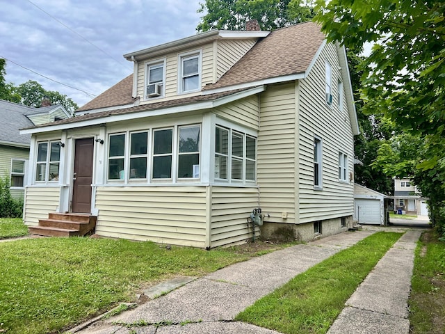 71 Forest Rd, West Haven, CT 06516 - bungalow-style house featuring entry steps, a shingled roof, a detached garage, a chimney, and a front lawn
