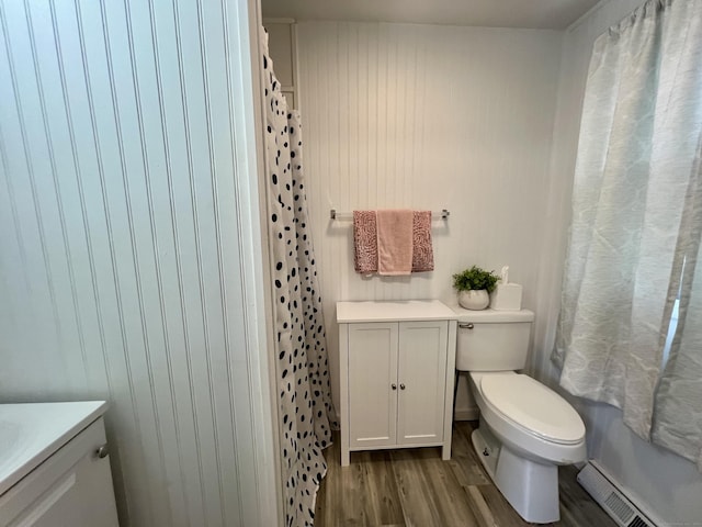 71 Forest Rd, West Haven, CT 06516 - full bathroom with vanity, wood finished floors, a baseboard radiator, and curtained shower