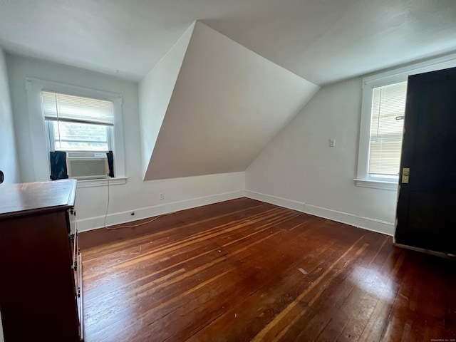 71 Forest Rd, West Haven, CT 06516 - additional living space featuring dark wood finished floors, vaulted ceiling, and cooling unit