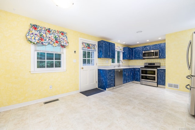 1 Boulder Rd Unit 1, Colchester, CT 06415 - kitchen featuring appliances with stainless steel finishes, blue cabinetry, light countertops, recessed lighting, and tasteful backsplash